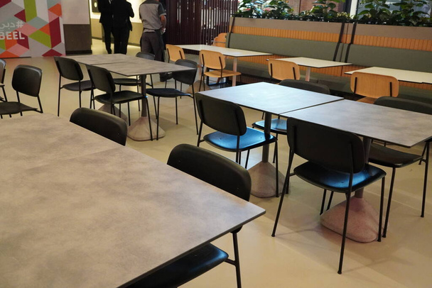 Food court with colorful tables and chairs in a shopping mall. Dubai UAE - October 2020 LKJ - Photo, Image