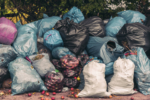 A closeup shot of a pile of trash bags - pollution concept - Photo, image