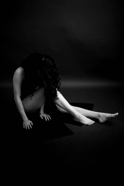 Black and white dramatic portrait of  young girl, body details, fashion and art - Valokuva, kuva