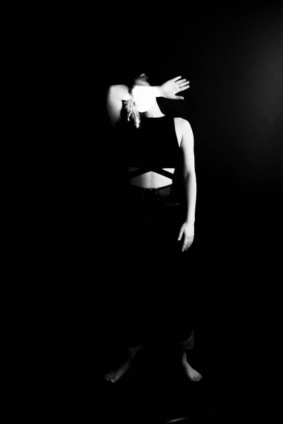 Black and white dramatic portrait of  young girl, body details, fashion and art - 写真・画像