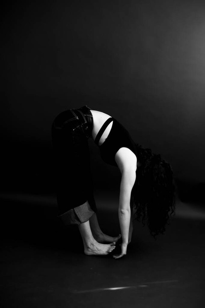 Black and white dramatic portrait of  young girl, body details, fashion and art - Valokuva, kuva