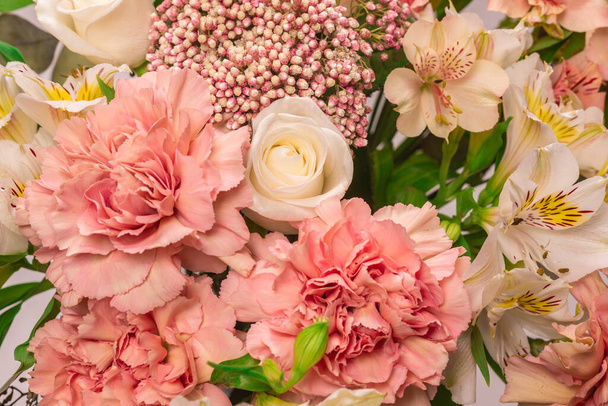 Bouquet of  soft pink flowers in pink wrapping paper.  - Photo, Image