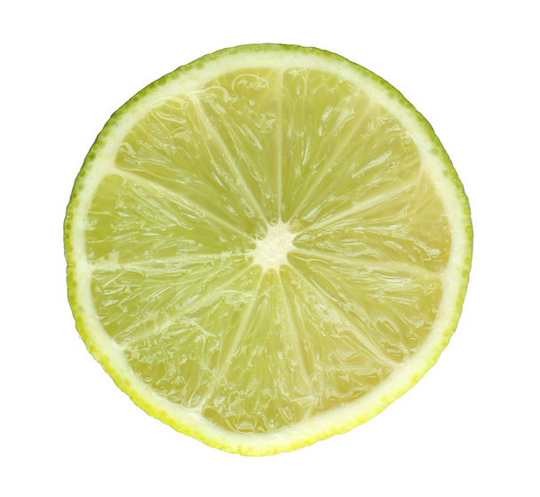 Slice of fresh lime, isolated on white - Photo, image