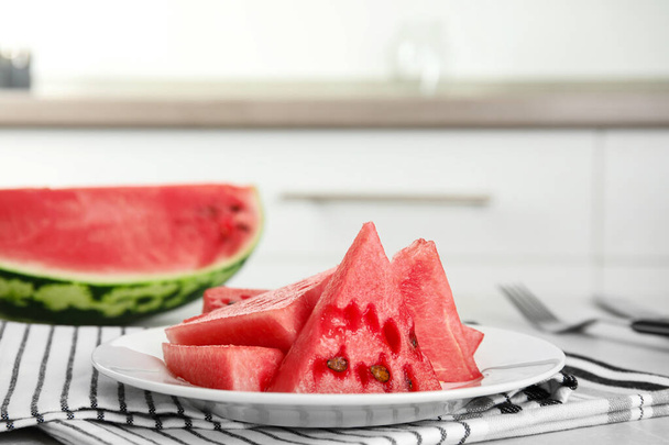 Yummy cut watermelon on table in kitchen, closeup - Photo, image