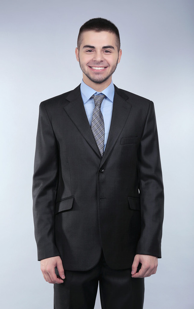 Business man on grey background - Foto, immagini