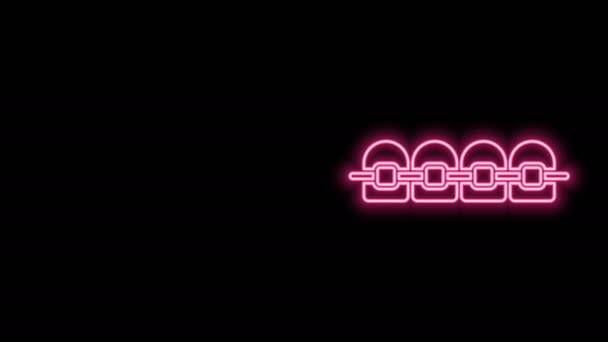 Ragyogó neon vonal Fogak fogszabályzó ikon elszigetelt fekete háttér. Fogak beállítása, fogsor fogszabályzóval. Fogászati koncepció. 4K Videó mozgás grafikus animáció - Felvétel, videó