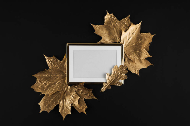 Autumn composition. Golden Frame with autumn golden maple leaves on black background. Flat lay, top view, copy space - Φωτογραφία, εικόνα