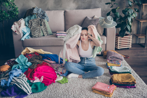 Photo of pretty stressed crying lady stay home quarantine many clothes heap stack floor wardrobe stuff pick select date outfit nothing to wear concept date preparation living room indoors - Fotoğraf, Görsel