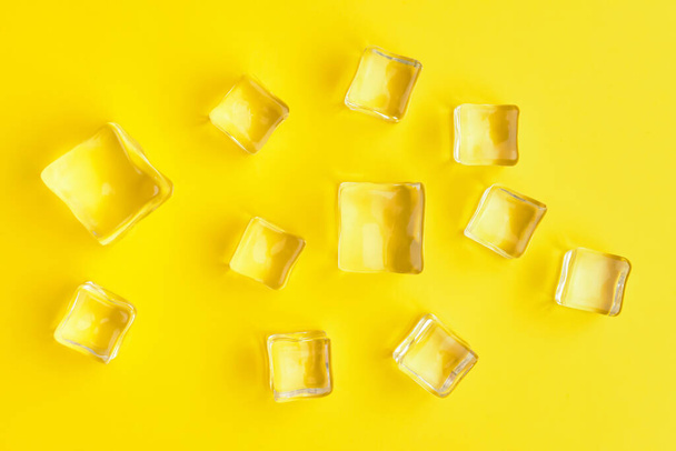 Ice cubes on color background - Photo, image