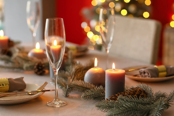 Beautiful table setting with Christmas decorations in living room - Photo, image