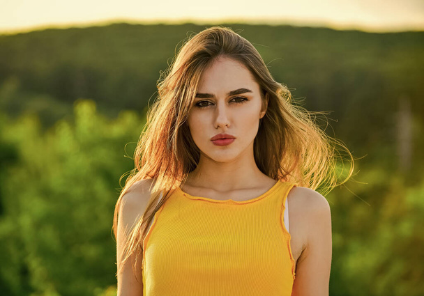 Beautiful young healthy woman. girl enjoy summer nature. beautiful sunny day. Healthy lifestyle. sexy girl outdoor. beauty and fashion. woman with brunette hair and makeup - Foto, afbeelding