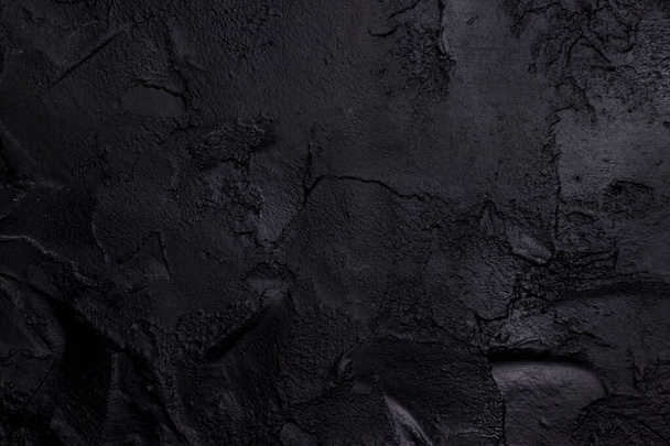 Black textured concrete close-up view - Foto, imagen