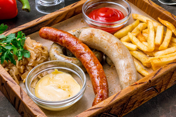assorted sausages with sauces - Fotografie, Obrázek