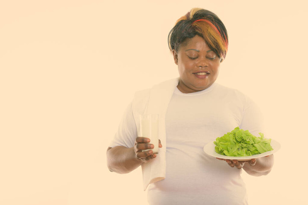 Studio shot of beautiful overweight African woman ready for gym isolated against white background - Φωτογραφία, εικόνα
