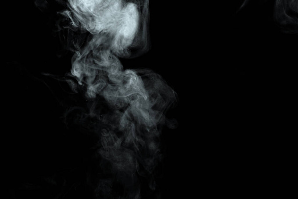 Abstract powder or smoke isolated on black background - Photo, image