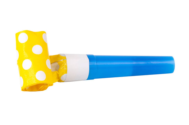 Rolled festive noisemaker or party whistle horn on the white isolated - Photo, Image