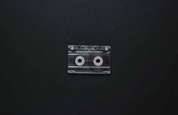 Audio cassette on a black background. Top view - Photo, Image