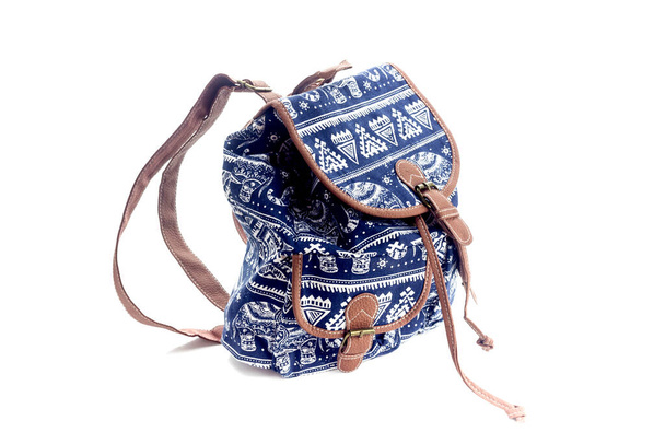 Accessories. Modern, blue, new, female backpack with a pattern close-up on a white background - Photo, Image