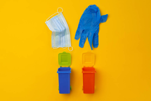 Colorful small trash has used infectious masks - Фото, изображение