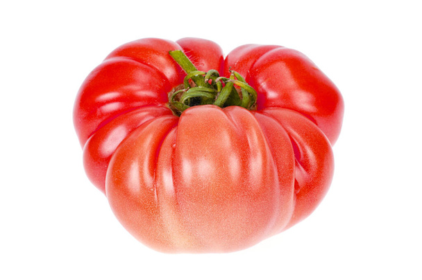 白を基調にした大きなピンク色の牛肉トマト。スタジオ写真 - 写真・画像