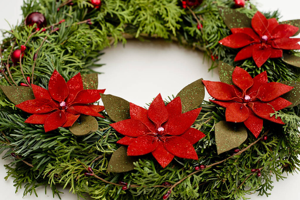 Festive background with an Advent wreath. Christmas lights. Handmade decoration. - Fotó, kép