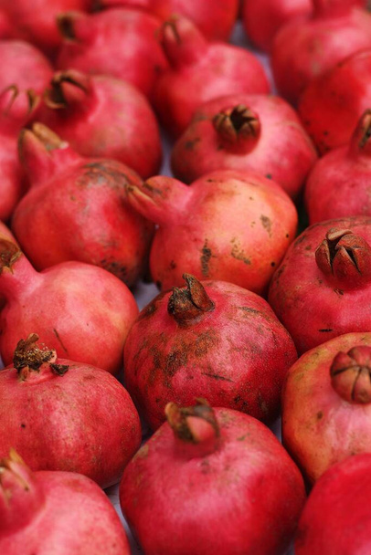 Ripe juicy pomegranates on the market macro - Photo, Image