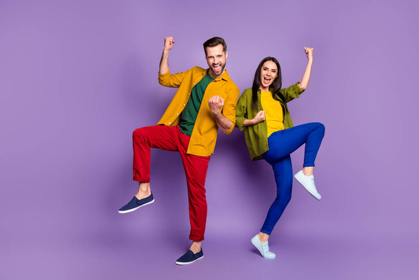 Full length body size view of his he her she nice attractive pretty lucky cheery glad ecstatic couple winners dancing rejoicing isolated bright vivid shine vibrant lilac violet purple color background - Valokuva, kuva
