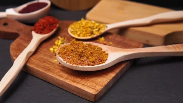 spices in a wooden bowl close-up on a brown wooden background. selective focus - Footage, Video