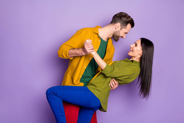 Profile side view portrait of his he her she nice attractive cheerful cheery glad couple embracing dancing waltz having fun isolated on bright vivid shine vibrant lilac violet purple color background - Photo, Image