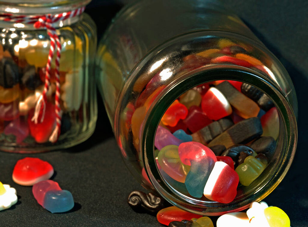 Colorful gummy candies in glass jars Delicious. Combination of vegetarian and non vegetarian sweets.  Colorful gummy candies. Gummy Sweeties, Jelly sweet, candy dessert.  Jelly gummy candies assortment. - Photo, Image