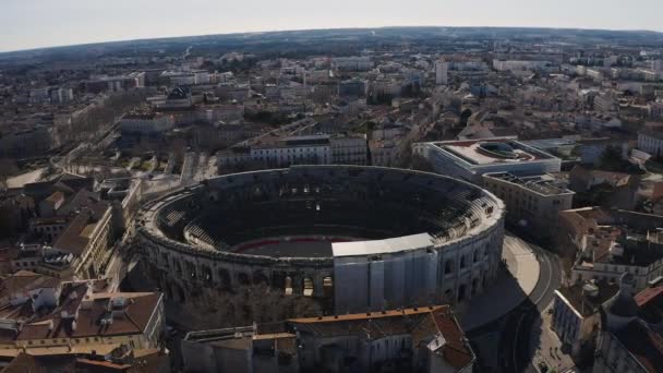Circular aerial shot around the Roman amphitheater Arena of Nimes elliptical building  - Footage, Video