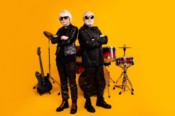 Portrait of his he her she nice attractive content serious grey-haired couple professional artist folded arms garage group isolated over bright vivid shine vibrant yellow color background - Foto, Imagem
