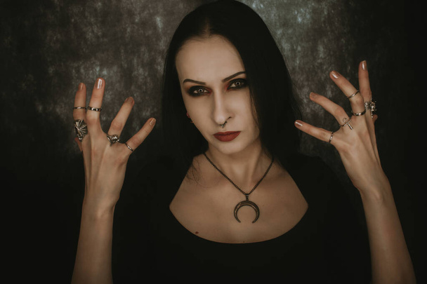 Portrait of beautiful gothic lady over dark background - Fotografie, Obrázek