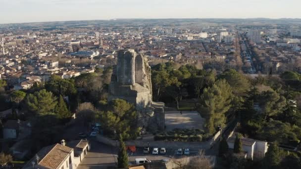 aerial flight towards Tour Magne with Nimes in background and the Jardins De La Fontaine - Footage, Video