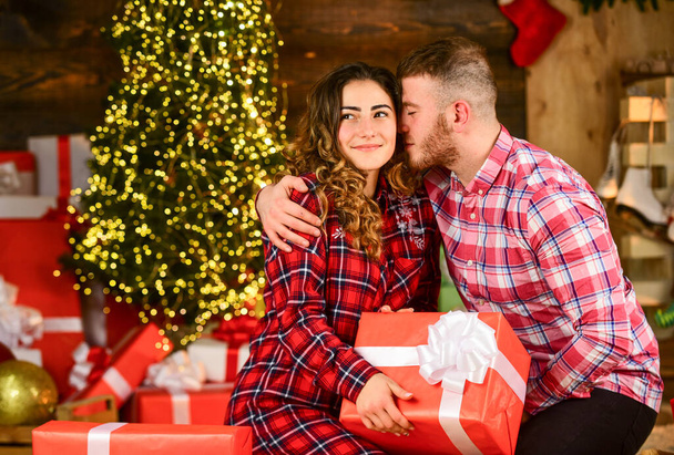 True love. Happiness and joy. Best holiday. Christmas time. Celebrate new year at home. Spread love. Happy woman and man. Holiday gift. Holiday mood. Couple in love making surprise for each other - Photo, Image