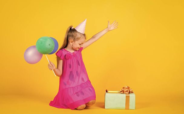 best party. imagination and inspiration. birthday party present. small girl with balloon. prepare for holiday. ready to celebrate. concept of dreaming. childhood happiness. kid fashion beauty - Photo, image