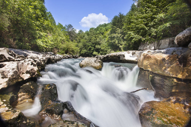 A beautiful view of a waterfall of the Valserine river in Bellegarde-sur-Valserine, France - 写真・画像