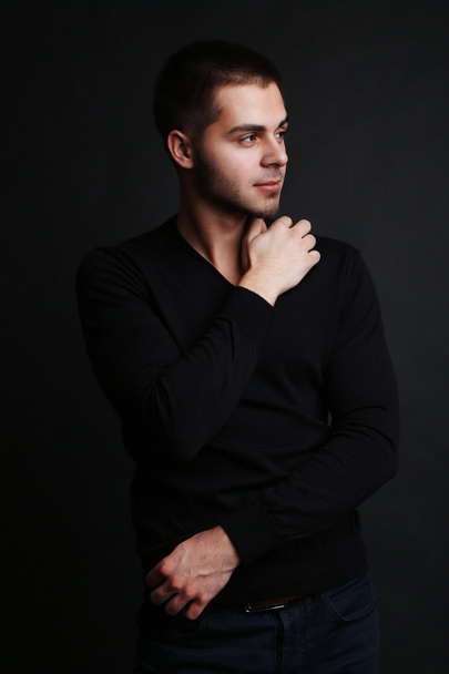 Handsome young man on dark background - Fotografie, Obrázek