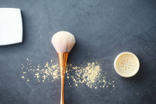 Powder and makeup brush. Brown powder on background. Makeup products. Style concept. - Foto, Imagem