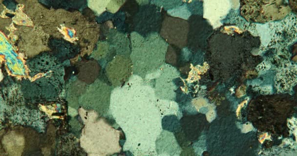 Gneiss thin section of stone under the microscope in polarized light - Footage, Video