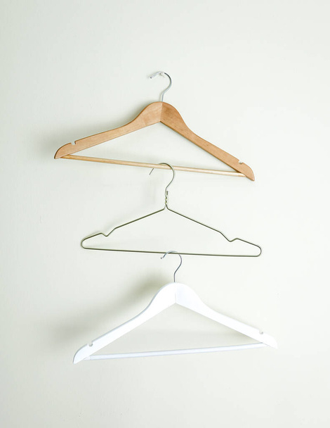 Three Different Empty Hanger on Wall Close Up - 写真・画像