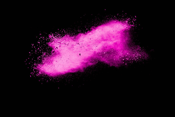 ピンクの塵粒子が黒い背景にスプラッシュ。ピンクの粉スプラッシュ. - 写真・画像