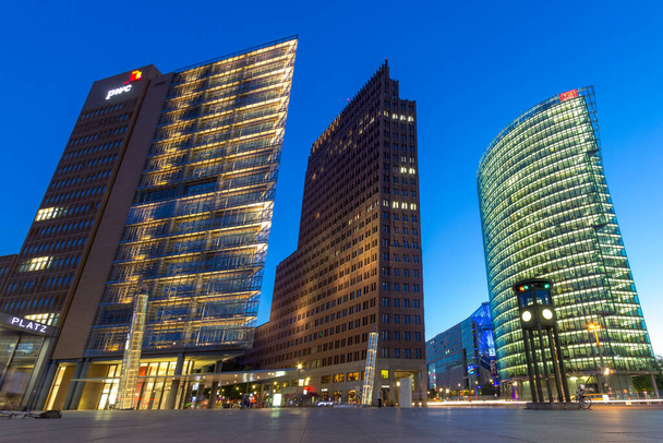 BERLIN, GERMANY - MAY 22, 2014: Evening view on the modern highrise and traffic at the Potsdamer Platz in the Berlin city centre. - Fotó, kép