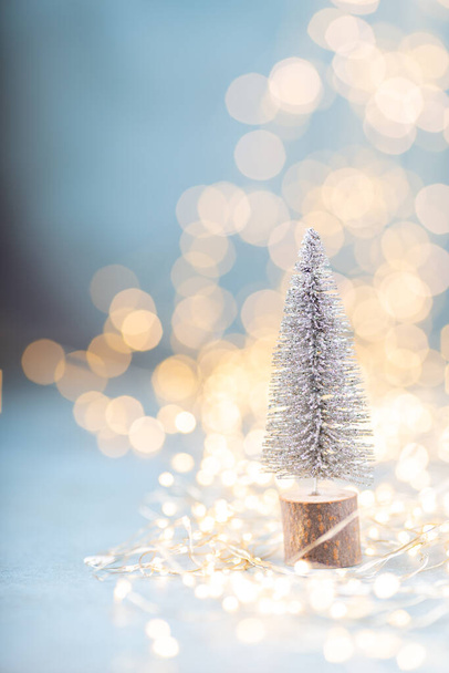 Christmas spruce with tree and blurred shiny lights. - Foto, Imagen