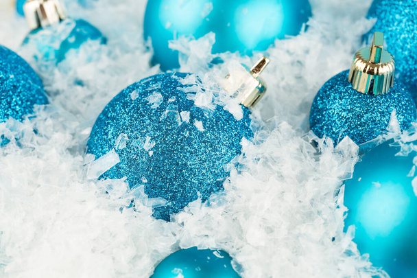 Christmas decoration with blue balls on the artificial snow background. - Fotografie, Obrázek