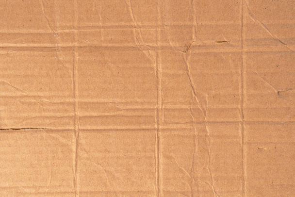 Ryppyinen pahvi rakenne lähikuva, paperi pakkaus tausta kopioi tilaa. Rutistettu ruskea paperi tausta - Valokuva, kuva