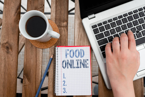 Conceptual hand writing showing Food Online. Business photo showcasing asking for something to eat using phone app or website Workplace overview with laptop used for individual interest. - Photo, Image