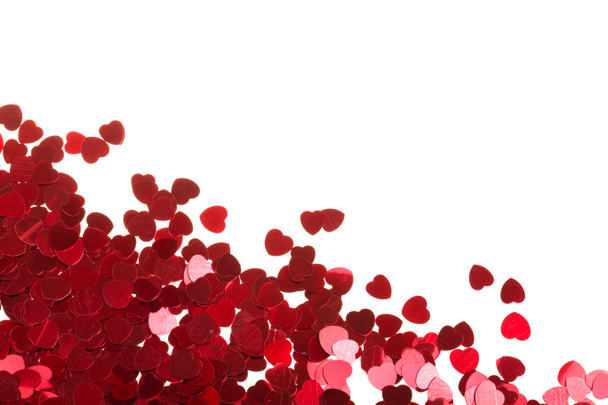 Red hearts confetti on white background - Foto, afbeelding