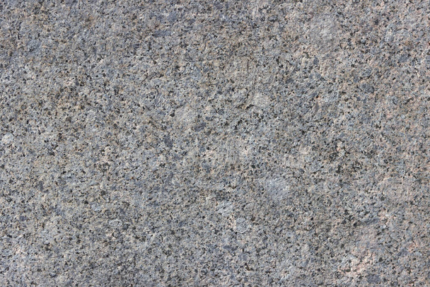 La textura de una losa de piedra natural de granito pulido. - Foto, Imagen