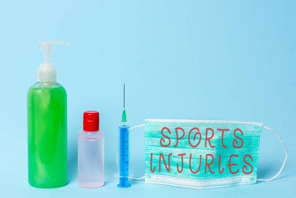 Word writing text Sports Injuries. Business concept for injuries that occur when engaging in sports or exercise Primary medical precautionary equipments for health care protection. - Photo, Image